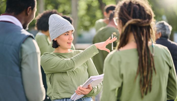 Woman explaining tasks to volunteers